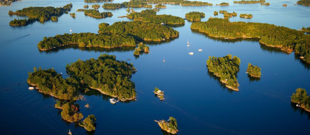 Aerial view of the Thousand Islands with boats on the water.